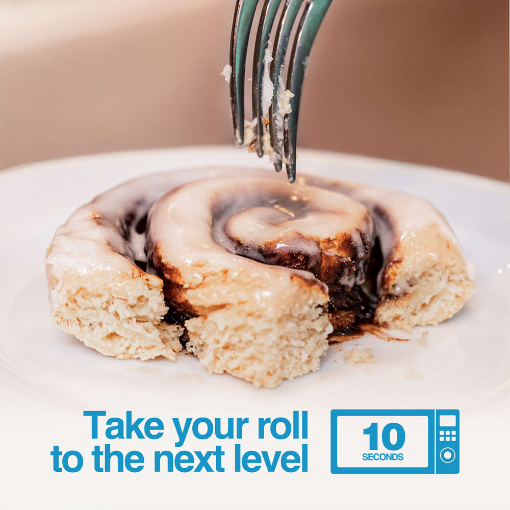 Fork cutting into warm Cinnamon Protein Roll - take your roll to the next level in 10 seconds